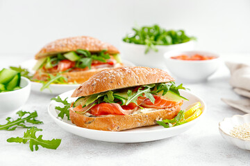 Sandwiches with salted salmon, arugula and cucumber. Breakfast