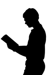 Side profile portrait silhouette of standing teenage boy reading book