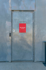 Bright red No Access signage on a shiny door at Waterloo Park Austin Texas