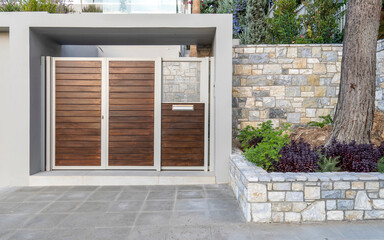 A contemporary house external entrance metal and wood door.
