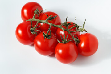 cherry tomatoes on the stem, cherry tomatoes on a white background