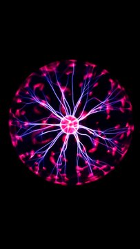 Plasma ball with smooth magenta-blue flames against dark background.