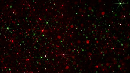 A composite video of various sized floating red and green particles against a black background with added light glint effect in a seamless loop animation. Christmas background overlay.
