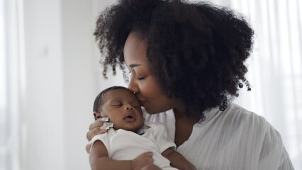 Close up portrait of beautiful young African American mother holding kissing sleep newborn baby in hospital. Healthcare medical love black afro woman lifestyle mother's day, breast concept  - Powered by Adobe
