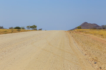 Fototapeta na wymiar Namibian landscape along the gravel road. Rehoboth, Namibia.