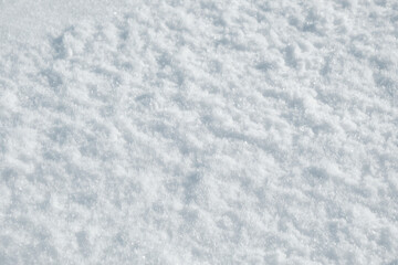 Freshly fallen white fluffy snow close up.