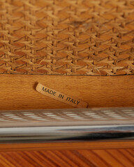 Vintage mid-century modern wooden chrome and cane Cantilever chair detail.