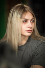Naklejka premium Portrait of a young beautiful fair-haired girl with a dress.