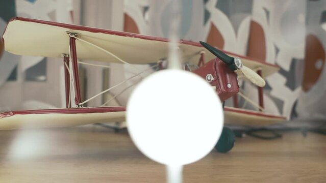 airplane model on a shelf in the apartment. Miniature copy of the aircraft, home decoration. High quality FullHD footage