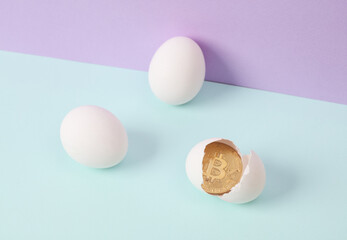 Creative layout. Bitcoin with eggshell on two tone pastel background. Conceptual pop. Minimal business still life.