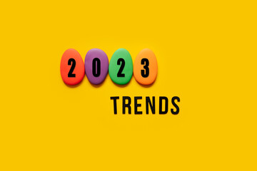 Word trends 2023 with colored blocks on yellow background. Modern trend concept banner for...