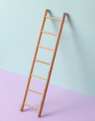 Wooden ladder on a pastel background. Leadership, career growth, business concept. Creative minimal layout - obrazy, fototapety, plakaty