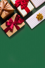 New Year concept with gift boxes on green background