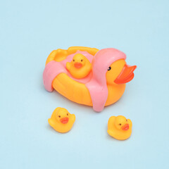 Creative layout, Rubber duck with slime on blue pastel background. Visual trend. Fresh idea. Concept pop