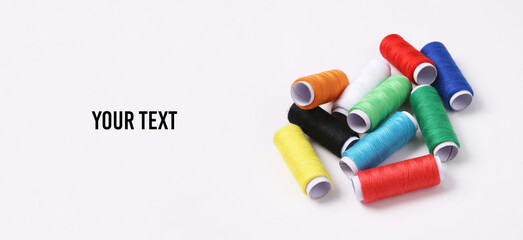 Skeins of colored thread on white background