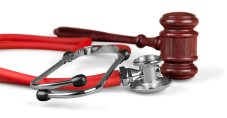Gavel and stethoscope  on background, symbol photo for bungling and medical error