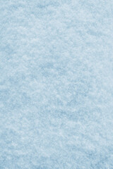 The texture of snow in a gentle light blue color