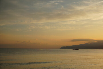 Sunrise behind the mountains over the Aegean Sea. October morning. The magic of nature