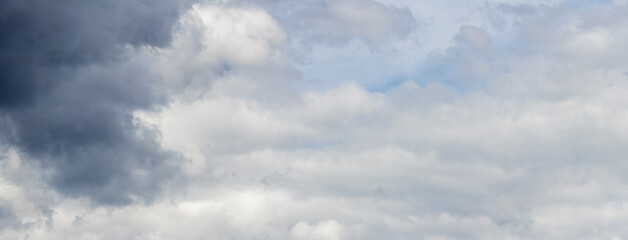 A dark cloud in a gloomy rainy sky