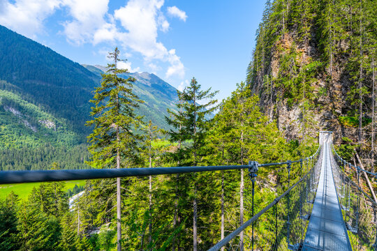 Simple Suspension Footbridge Over Mountain Valley