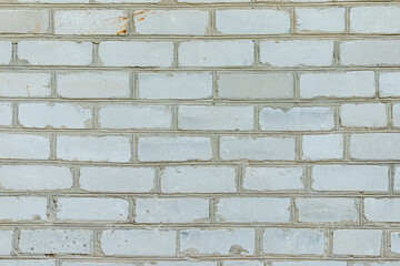 White brick wall made from used material. Abstract texture background image