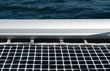 Catamaran and Trimaran multihull trampoline netting, connection ropes to deck