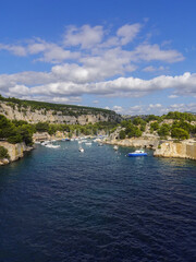 The cove of Port-Miou with its turquoise sea water and its cloudy sky. Provence.