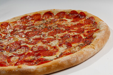..Pepperoni pizza on white background. Copy space. Selective focus