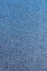 macro photography of black and blue spray paint on white paper