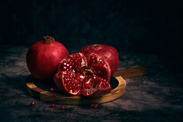 juicy pomegranate on a dark background