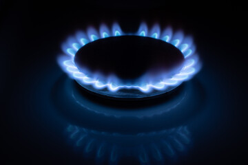 Gas burns with blue flames. Gas crisis around the world. Selective focus on the flame. Soft focus on the picture. Natural gas for housing