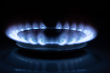 Gas burns with blue flames. Gas crisis around the world. Selective focus on the flame. Soft focus on the picture. Natural gas for housing