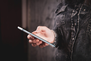 a young girl holding a phone in her hands