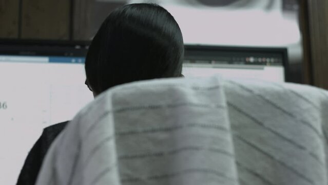 Young Female Office Employee Performs Tasks at Her Desk 4K