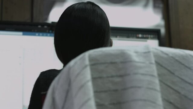 Young Female Office Employee Performs Tasks at Her Desk 4K