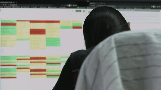 Young Female Office Employee Performs Tasks at Her Desk 4K