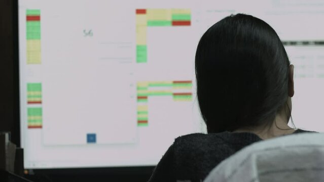 Young Female Office Employee Performs Tasks at Her Desk 4K