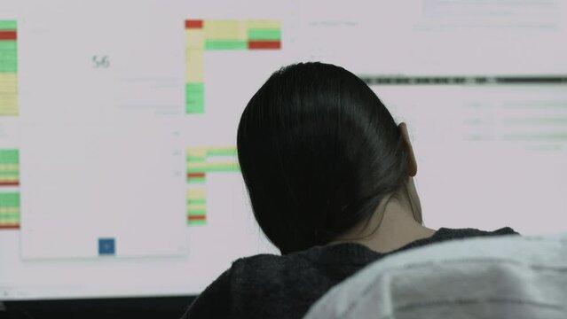 Young Female Office Employee Performs Tasks at Her Desk 4K