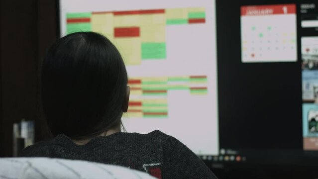 Young Female Office Employee Performs Tasks at Her Desk 4K