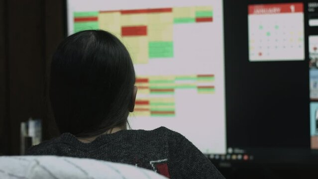 Young Female Office Employee Performs Tasks at Her Desk 4K