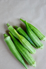 Okra isolated on beige background