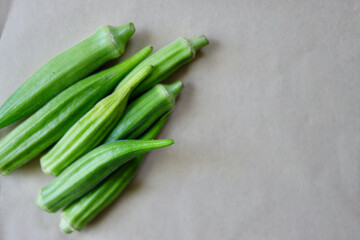 Okra isolated on beige background