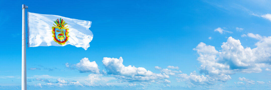 Guerrero, state of Mexico - flag waving on a blue sky in beautiful clouds - Horizontal banner
