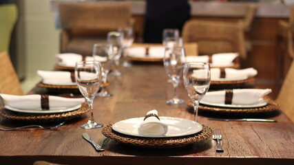 Dining table with cutlery and plates