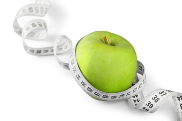 Body Measuring Tape Around A Green Apple