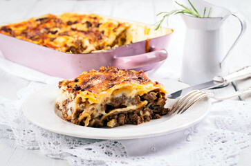 Traditional Italian lasagne baked with pasta sheets and mincemeat and served as close-up on classic design plate
