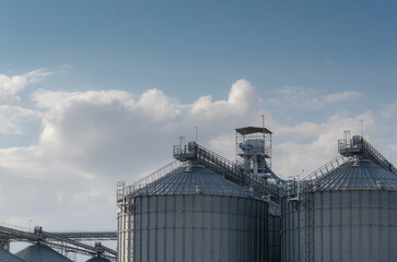 Cloudy sky with silo. Grain Storage Silos..
