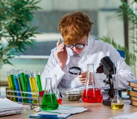 Young crazy chemist working in the lab