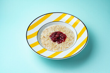 oatmeal in a plate on a colored background