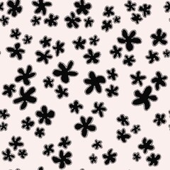 Trendy fabric pattern with hand drawn miniature black flowers on white background.Fashion design.Motifs scattered random.Elegant template for fashion prints,fashion textile,fabric,gift wrapping paper